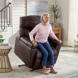 Older woman rising out of a Golden Technologies lift chair that is in the standing position