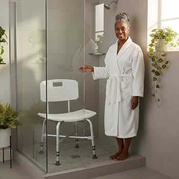 African American Woman showing a Nova Medical Product Shower Chair in a glass shower