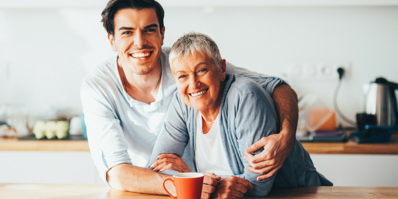 Photo of a man hugging his mom.