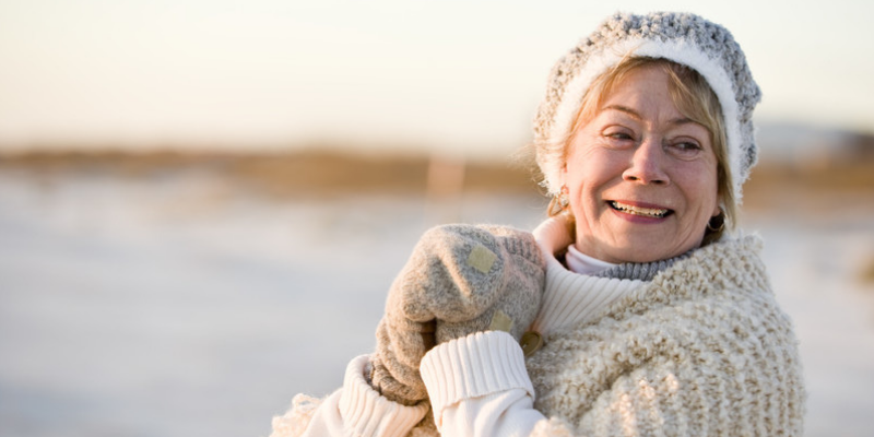 Photo of a woman outside bundled up in winter clothes.